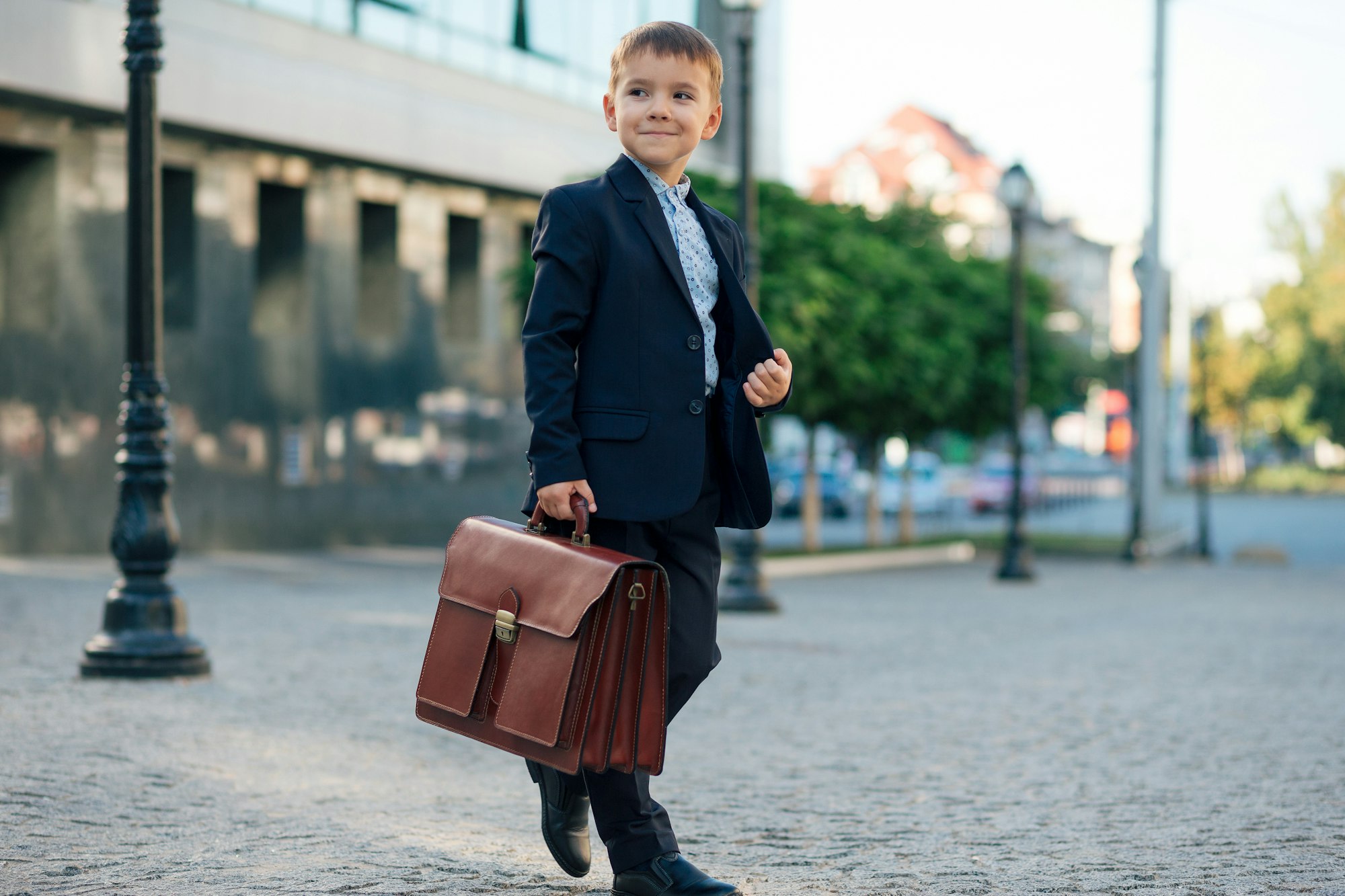 Future businessman in formal costume with briefcase